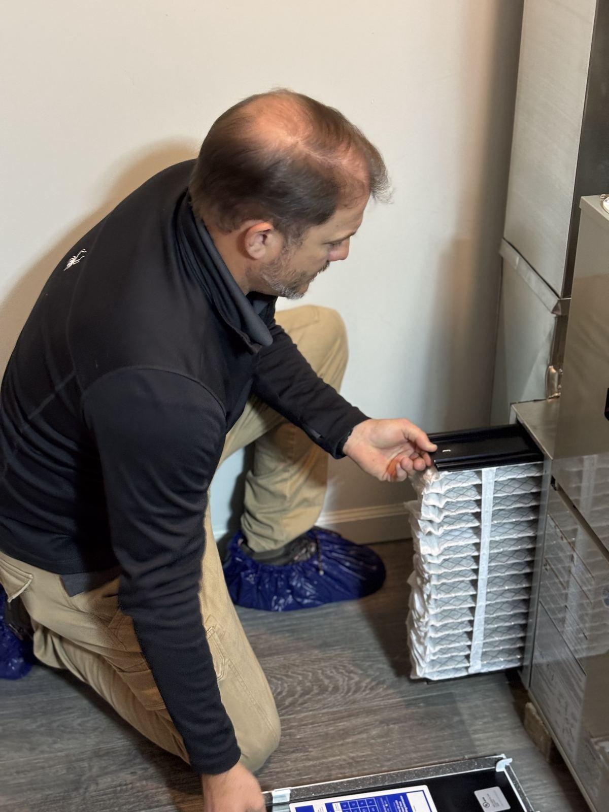 Delta T technician performing a maintenance visit