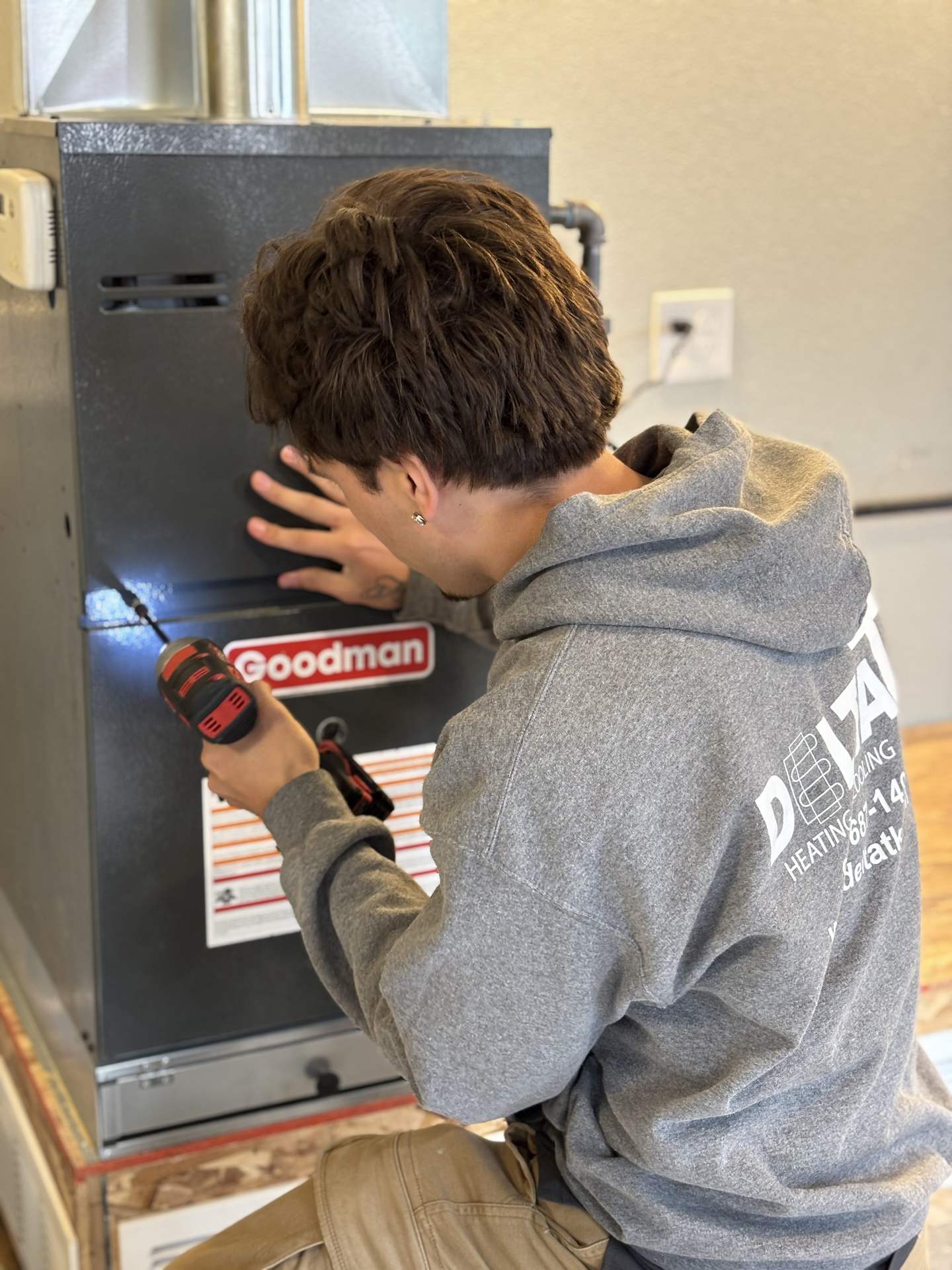 Delta T technician installing line-set bracketing